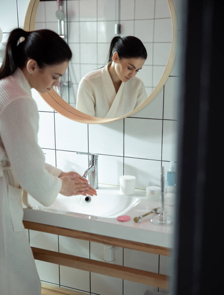 Woman taking care of hygiene at home stock photo - 写真・画像