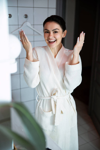 Happy woman washing in bathroom stock photo - Фото, изображение