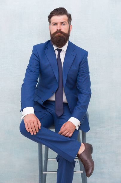 Fairness and justice. Classy and formal. Bearded man wear formal suit. Elegant lawyer sit on chair. Business meeting. Formal event. Man with beard and mustache confident lawyer. Your lawyer - Foto, afbeelding