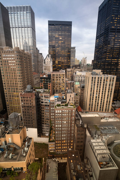 Densely packed buildings and skyscrapers of the Manhattan urban skyline in New York USA - Photo, image