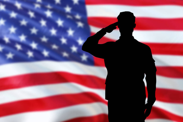 Soldiers silhouette saluting the USA flag for memorial day or veterans day - Photo, Image