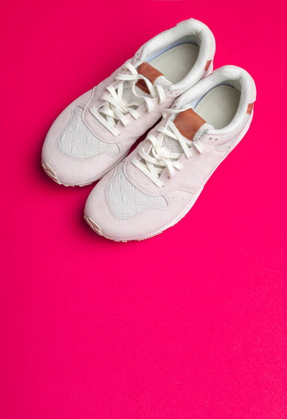 Pair of sneakers on red background, flat lay - Foto, Bild