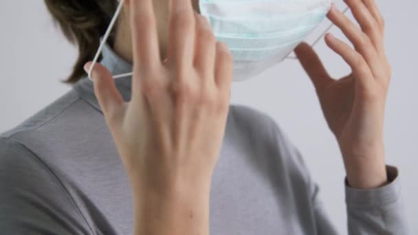 young woman wearing protective medical mask - Imágenes, Vídeo