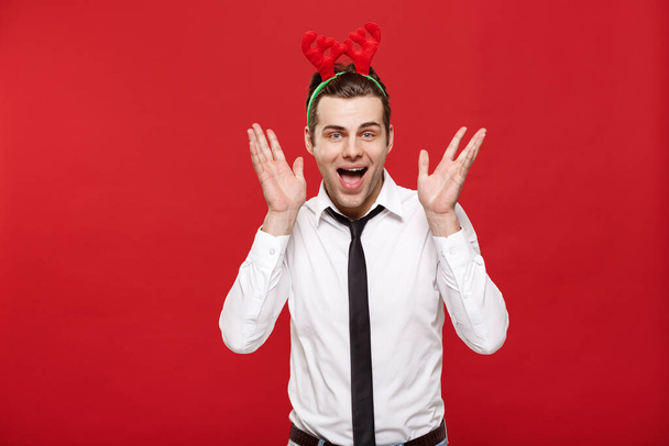 Christmas Concept - portrait happy Santa christmas businessman exciting and surprising facial expression over red background. - Foto, Imagem