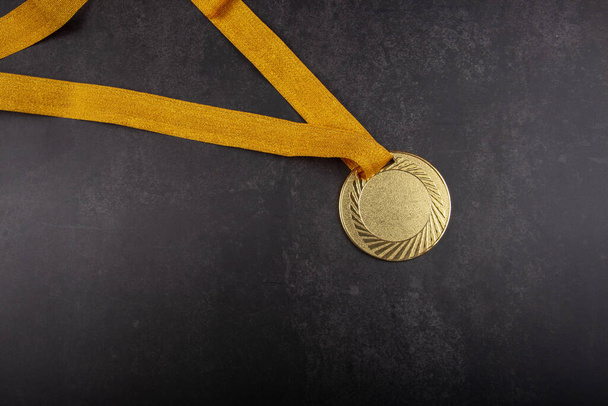 Gold medal on background concept for winning or success - Photo, Image