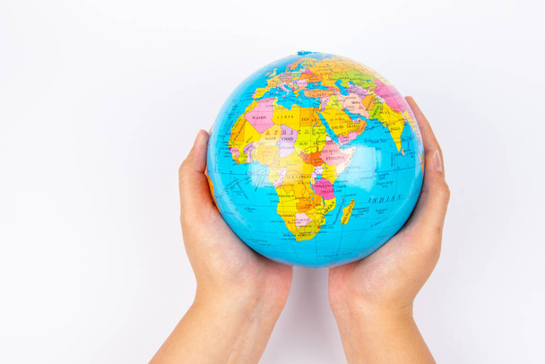 Lady hand hold earth globe on white background - Foto, immagini
