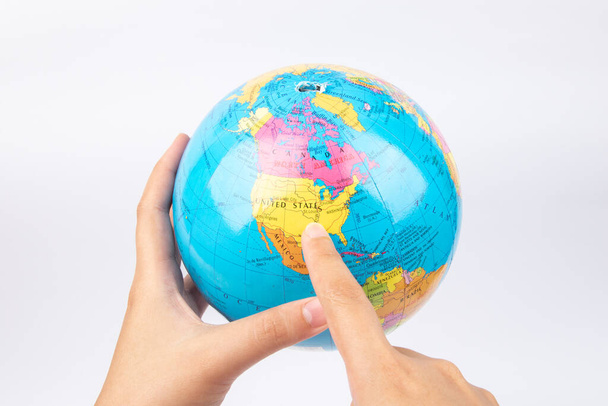 Lady hand hold earth globe on white background - Foto, imagen