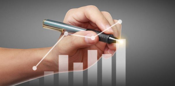 Hand drawing a chart, graph stock of growth - Photo, Image