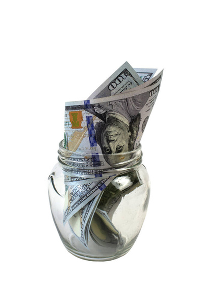 isolated on white background Dollars in a glass jar, symbol of the crisis, venality, wealth, hoarding - Photo, Image