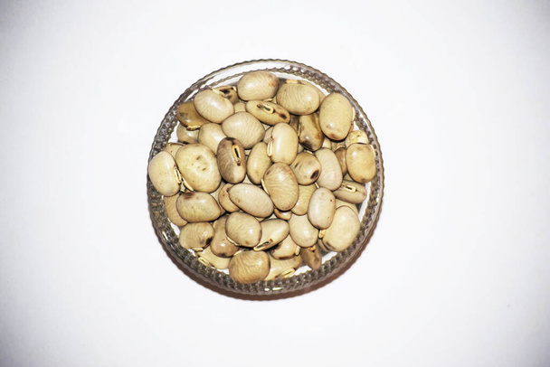 Samtbohne oder Cowitch oder Cowage Lacuna Bohnen Lyoner Bohne Konch beej Mucuna pruriens verwendet als ayurvedische Kräuterhülsenfrüchte - Foto, Bild