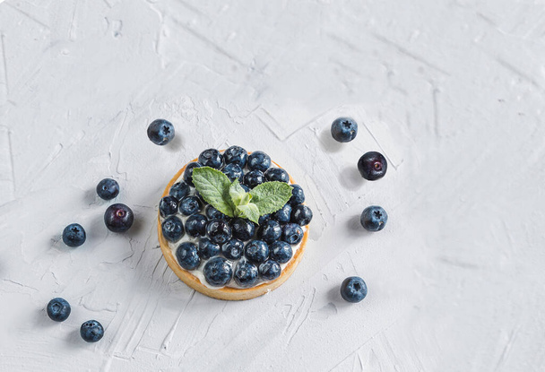 Incredibly beautiful cupcake with blueberries and a divine cream - Photo, Image