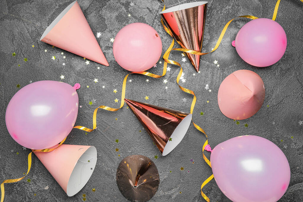 Party hats and decor on grey background - Photo, Image
