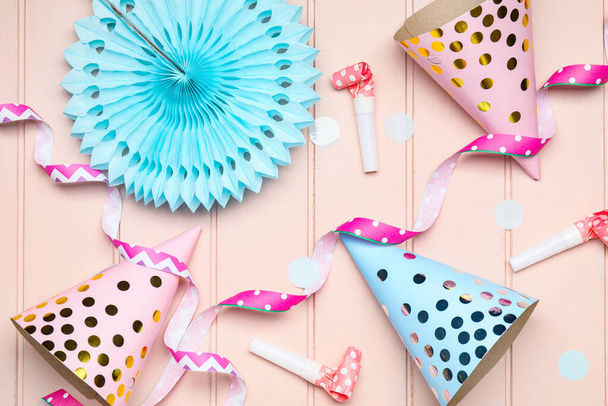 Party hats and decor on wooden background - Photo, Image