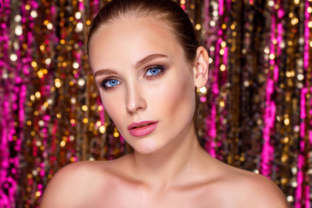 Beauty portrait of a High Fashion model woman in colorful bright neon lights posing in studio, night club On colourful vivid sequin background - Photo, Image