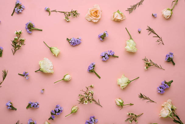 flower composition, roses, eustoma, limonium on pastel pink background, flat lay, top view, spring concept - Photo, Image