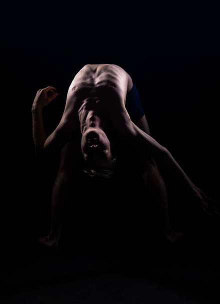 Graceful slender dancer performing a dance routine in the studio - Photo, Image