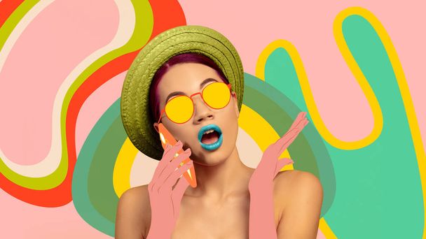 Portrait of a beautiful young woman with bright colorful painted design - 写真・画像