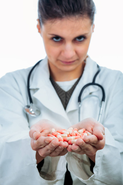 Female doctor with handfull of pills - Foto, Imagem