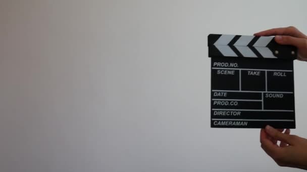 Female holding wooden clapperboard. Cinematography production concept. Copy space advertising mock up. - Footage, Video