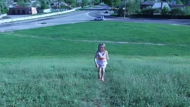 Little girl running up to the hill - Footage, Video