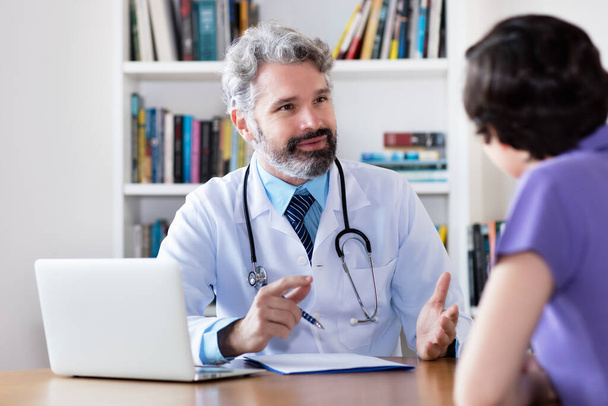 Patient asking doctor about coronavirus test at hospital or clinic - Fotó, kép