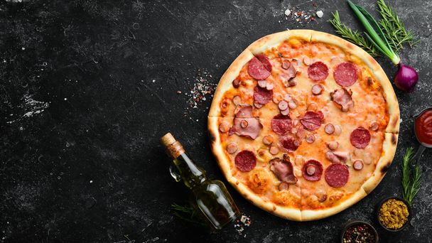 Homemade pizza with bacon and salami on the table. Rustic style. Top view. - Фото, зображення