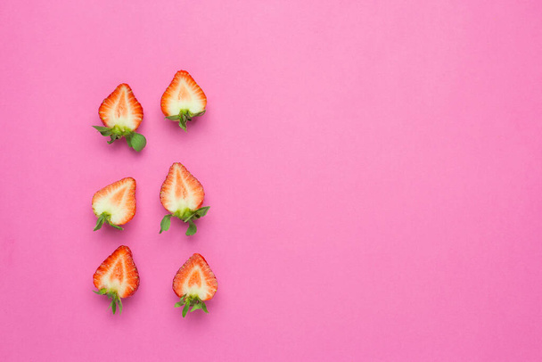 Strawberries isolated on pink background. Fresh berry flat lay. Creative Minimal food concept - Foto, imagen