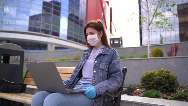 Young woman wearing medical gloves and face mask communicating  - Footage, Video