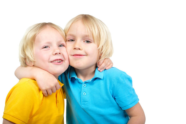 Two caucasian boys brothers posing in studio - Photo, Image