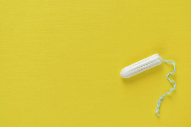 A womens tampon. Menstruation time. Hygiene and security. - Photo, Image