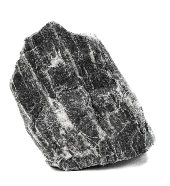 Dark grey single stone of a different form isolated on a white background. Whole large stone isolated on a white background. Front view. Rock stone isolated on white background. With soft shadow. - Photo, image