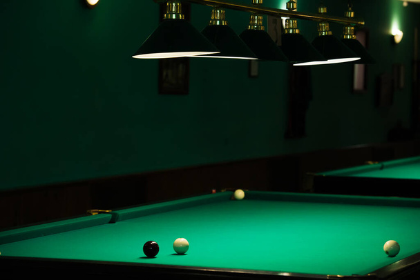 Sports game of billiards on a green cloth. Billiards white billiard balls close up - Photo, Image