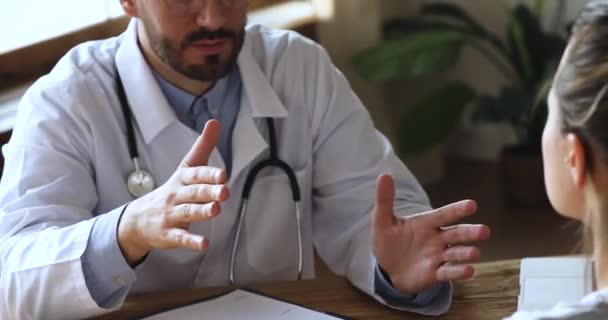 Doctor general practitioner shaking hands with female patient. - Video, Çekim