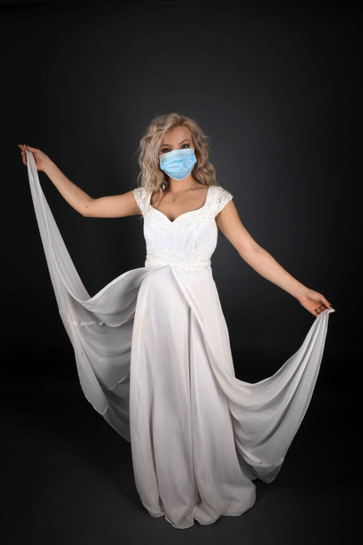 Woman in Wedding Dress and respirator mask - Photo, Image