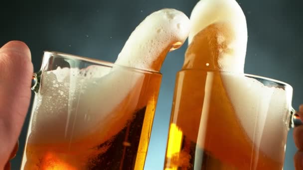 Super slow motion of hitting beer mugs together, cheers concept. Filmed on high speed cinema camera, 1000 fps. - Video