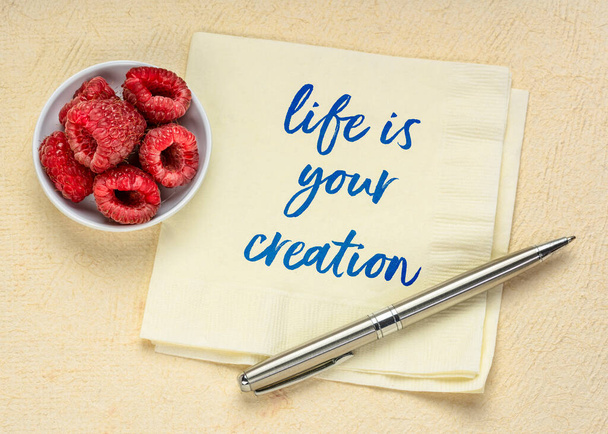 life is your creation inspirational note - handwriting on a napkin with fresh raspberries, personal development and lifestyle concept - Valokuva, kuva