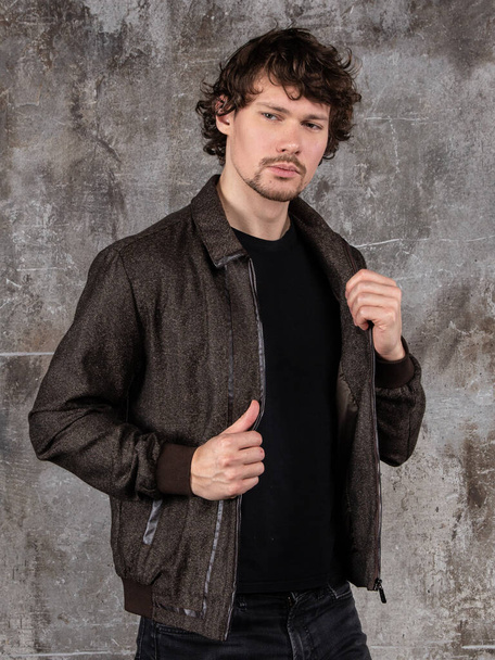 Studio portrait of attractive young man. Young Male Fashion Model Posing In Casual Outfit.  - Valokuva, kuva