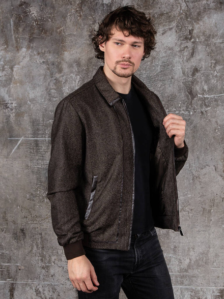 Studio portrait of attractive young man. Young Male Fashion Model Posing In Casual Outfit.  - Foto, afbeelding