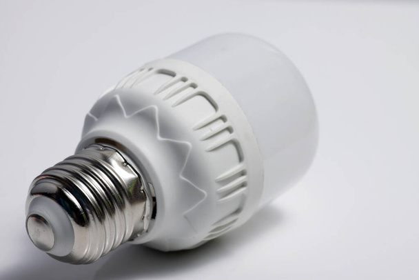 Close up shot of LED lamp with e27 type socket on an isolated white background - Photo, Image