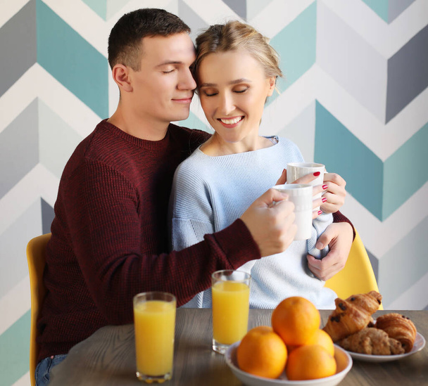 young beautiful couple having breakfast table - Foto, immagini