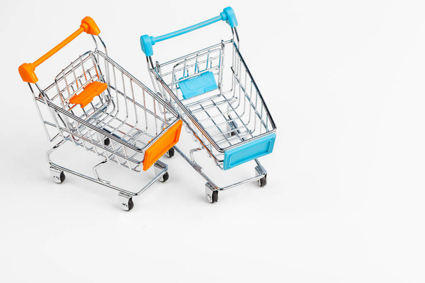 Empty grocery toy shopping cart on a table - Фото, зображення