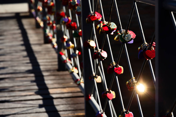 Shining key lock in heart shape on love bridge in Tbilisi, Georgia - Photo, Image