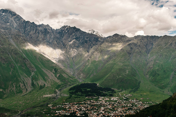 Kazbegi area. Mountains in Georgia. Settlement, village in the mountains, June - Photo, Image