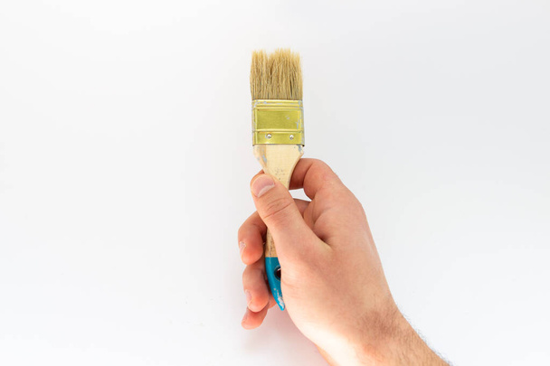 brush for painting in the hand of a man - Photo, Image