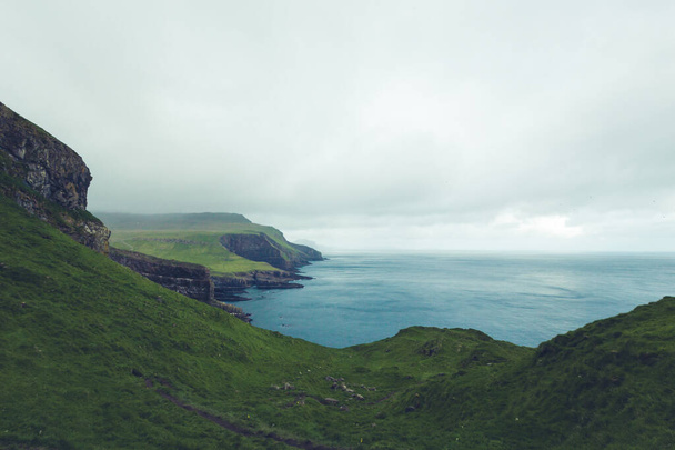 Dramatic landscape on Faroe Islands. The nature of the Faroe Islands in the north Atlantic - Photo, Image