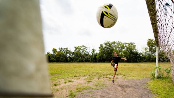 adult sporty man playing soccer outdoors - Foto, afbeelding