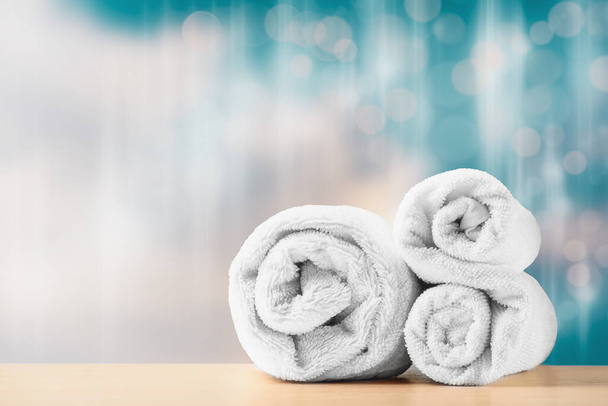 Two folded towels for spa massage. Spa treatment concept - Фото, изображение
