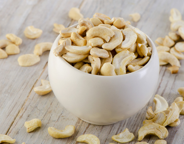 Cashew nuts on wooden table - Foto, Imagen
