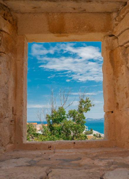 view of the sea through the window in the castle - Photo, Image