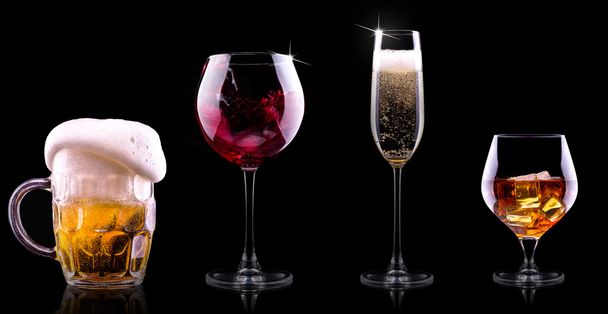 Set with different drinks on black background - Фото, изображение